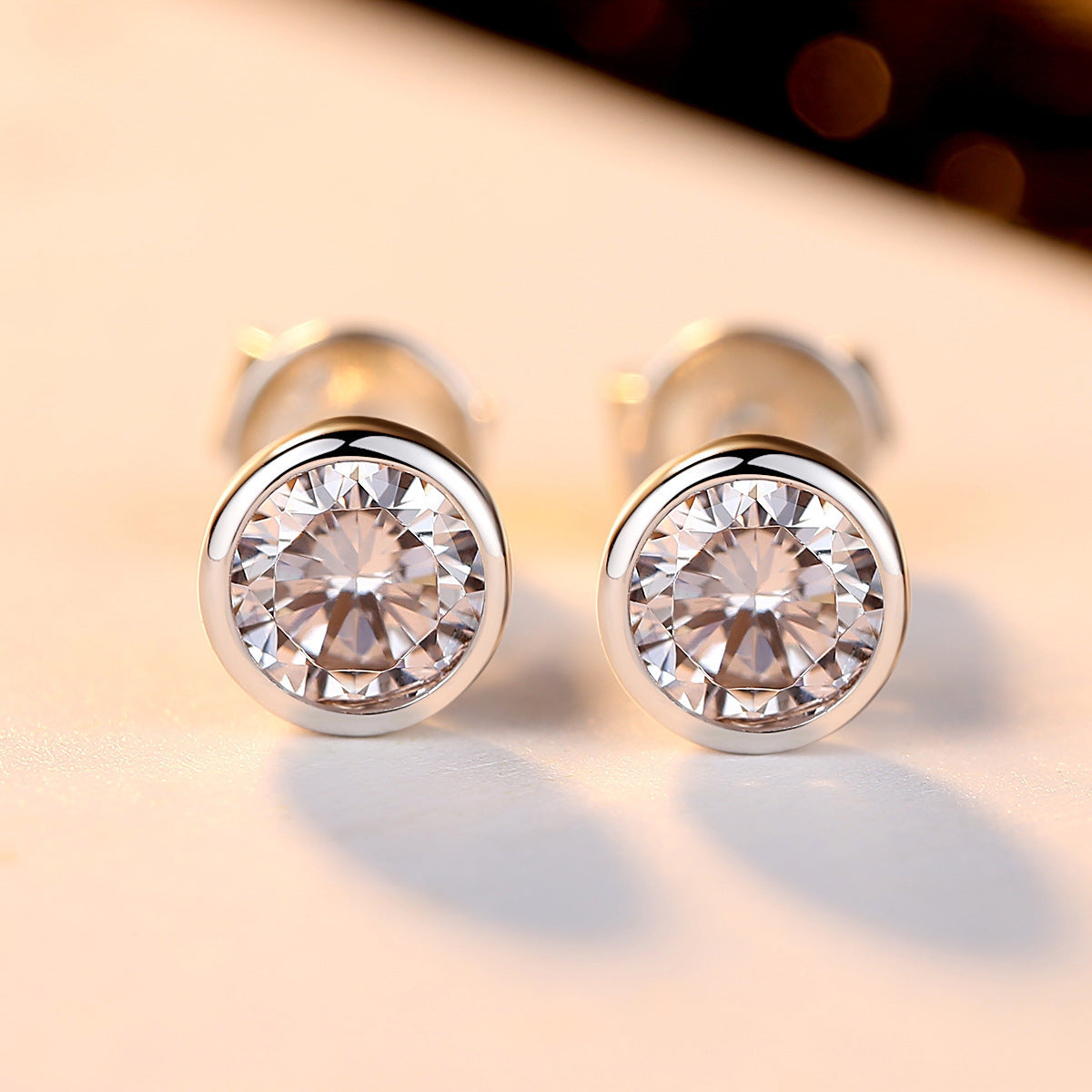 Simulated zircon solitaire bezel earrings