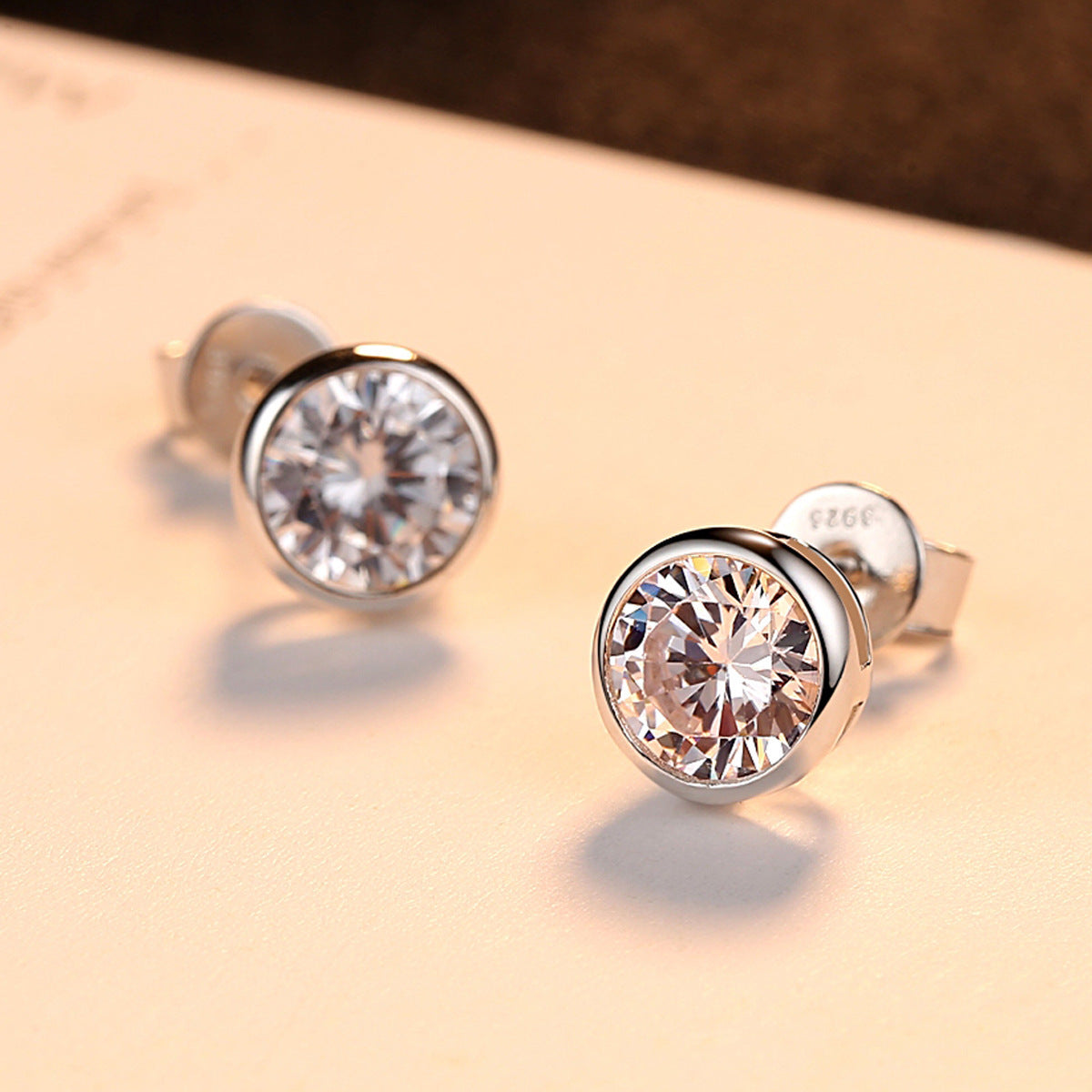 Simulated zircon solitaire bezel earrings